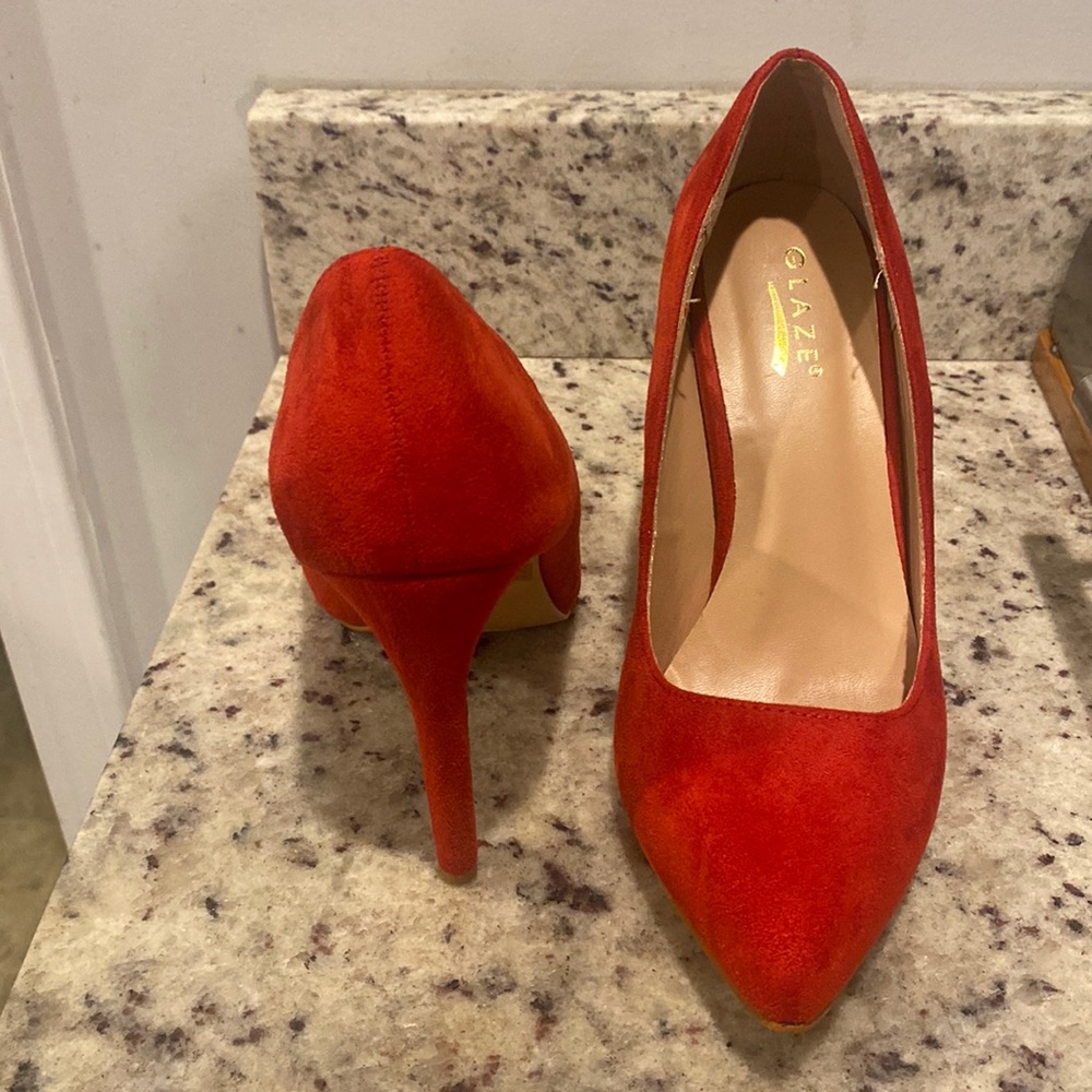 I am selling a pair of red suede heels size 9